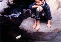 Child by the water